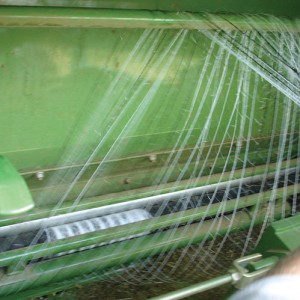 Net wrapping on feeding rollers